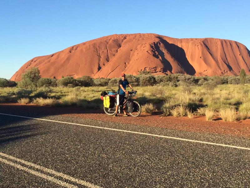 Round the world cycle tourer Tim Millikin by Uluru Ayers Rock
