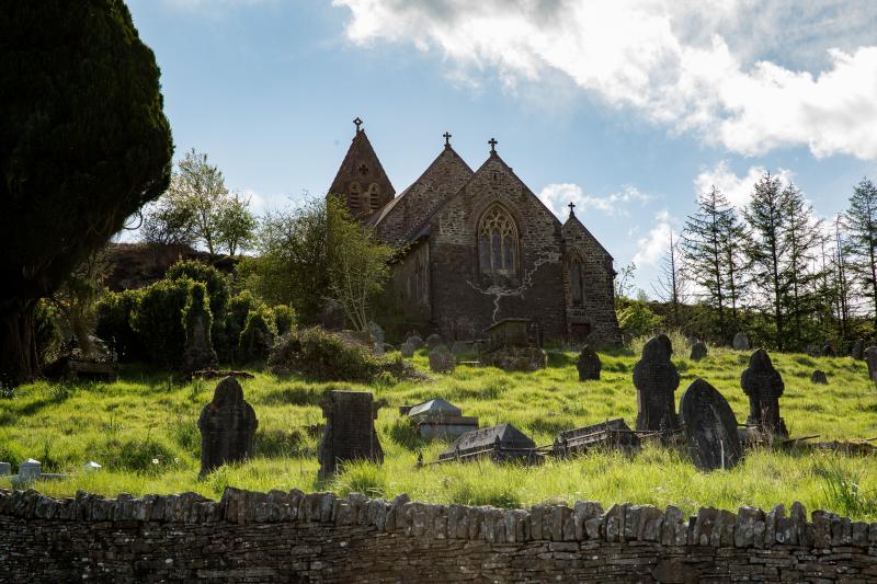 Church with gravestones in front