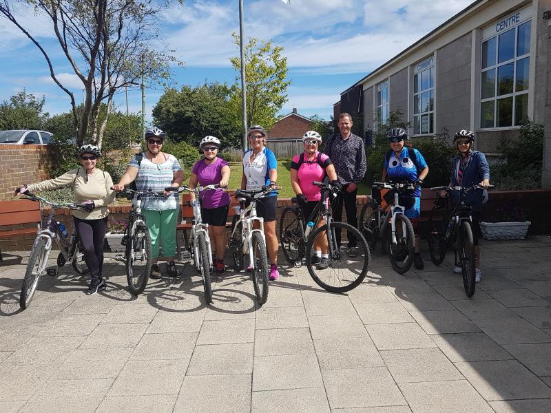 Group photo of Alison and her cycling group