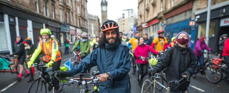 People pushing bikes at a protest march