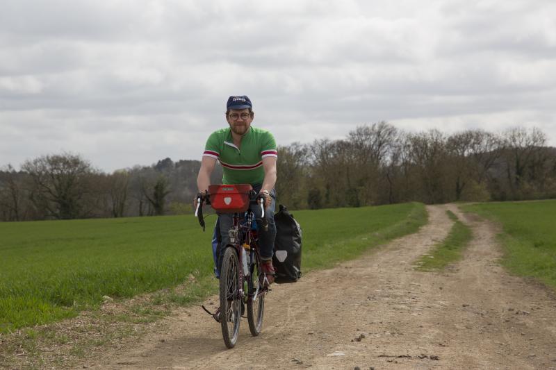 Cyclist on a rough farm track in France