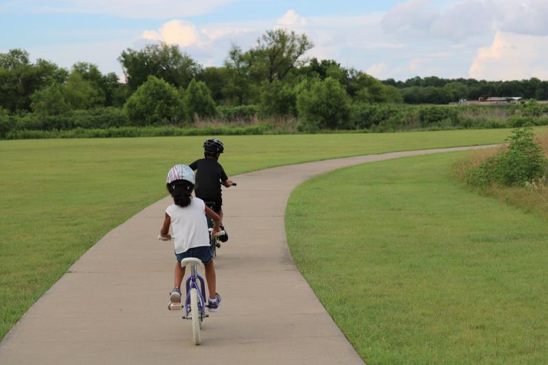 Children riding through the park