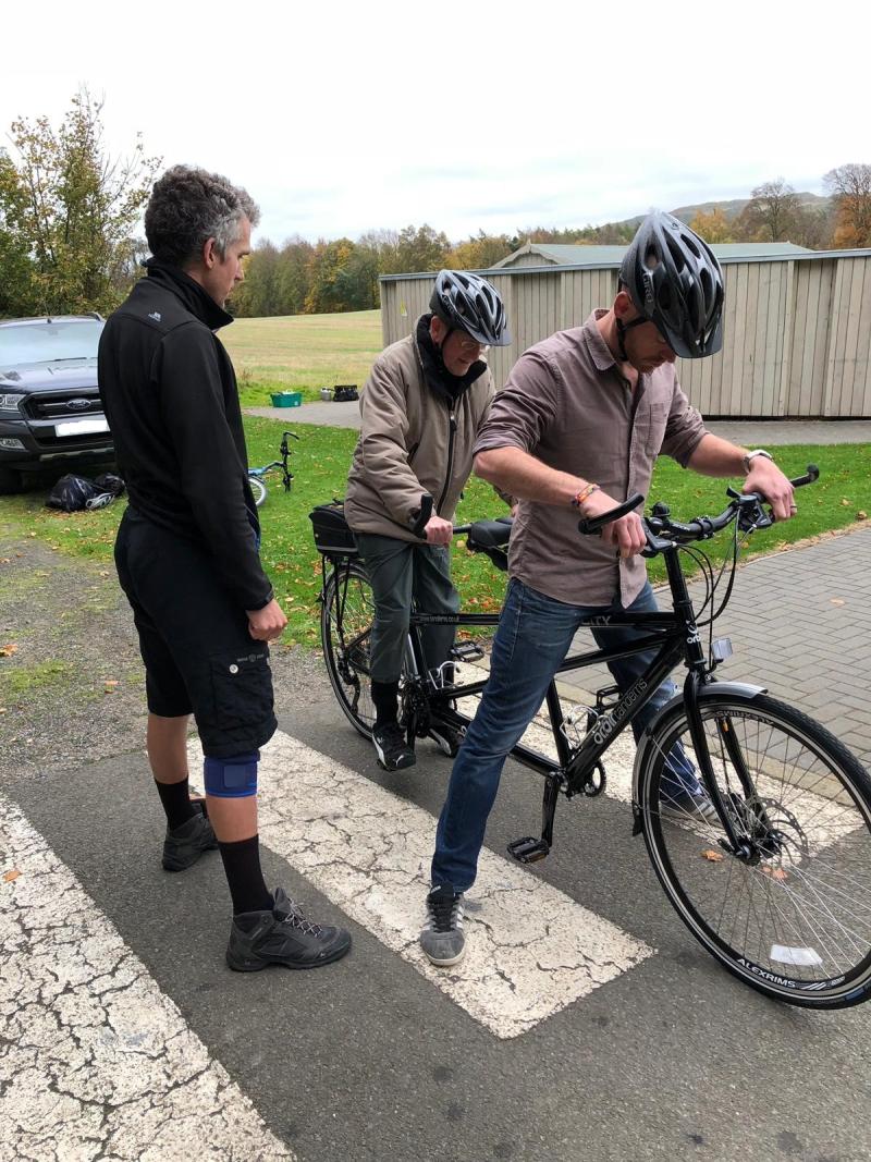 Cycling UK's David Glover helping Bryce get underway