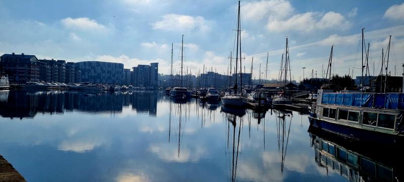 Harbour with boats and tall buildings