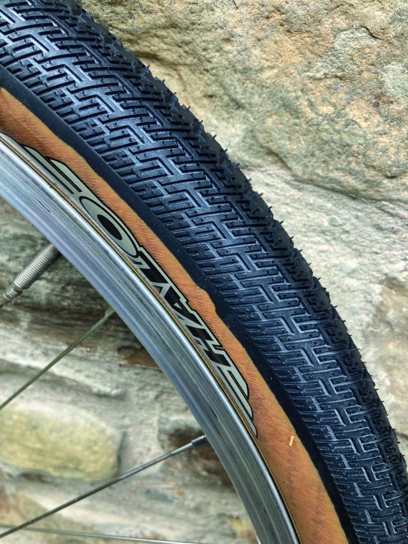Side profile of a gravel tyre seated on a bicycle wheel