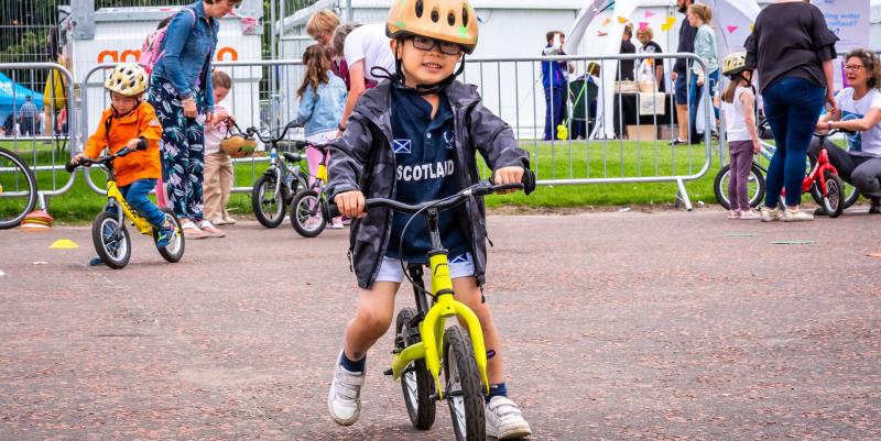 Young child on balance bike