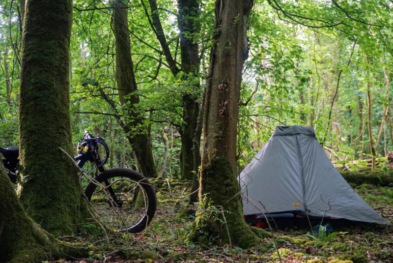 A tent set up in the woods