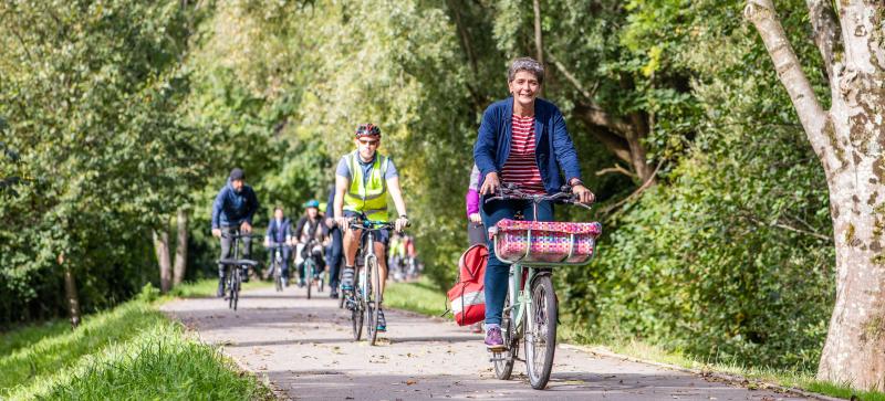 People cycling along a traffic free path