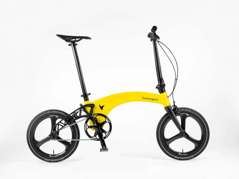 A bright yellow folding bicycle