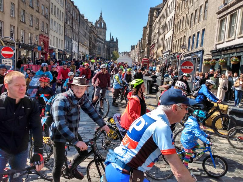 Pedal on Parliament riders on Cannongate in Edinburgh