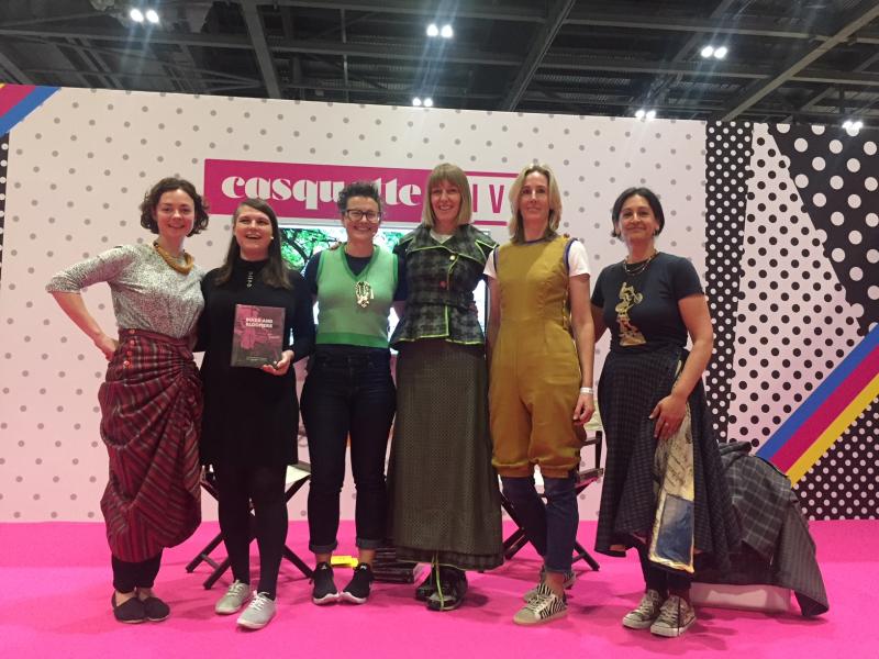 Author Kat Jungnickel on the Casquette live stand with models wearing Victorian era women's cycling clothing