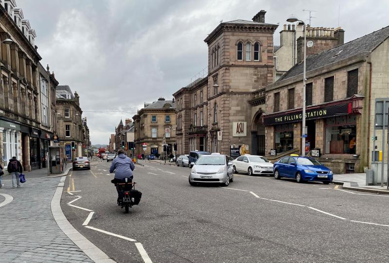 Emily Williams, bicycle mayor of Inverness, cycling along Academy Street
