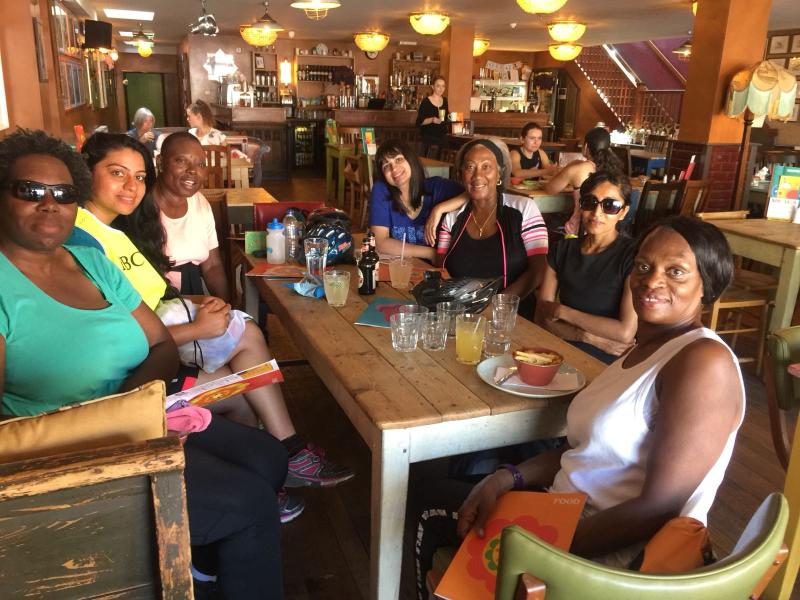 The Joyful Bellas and Fellas take a break from the sun in a cool cafe