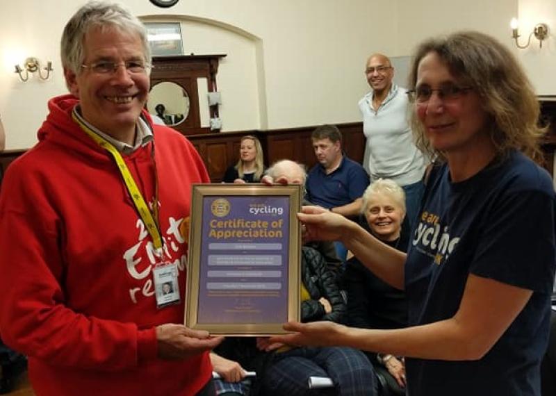 Jim Brown receives his Certificate of Appreciation from incoming Secretary Tina Walker  Photo by Cycling UK Stevenage