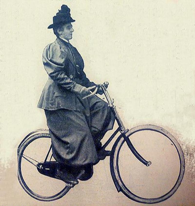 A printed photo of a Victorian lady riding a Dutch-style bicycle