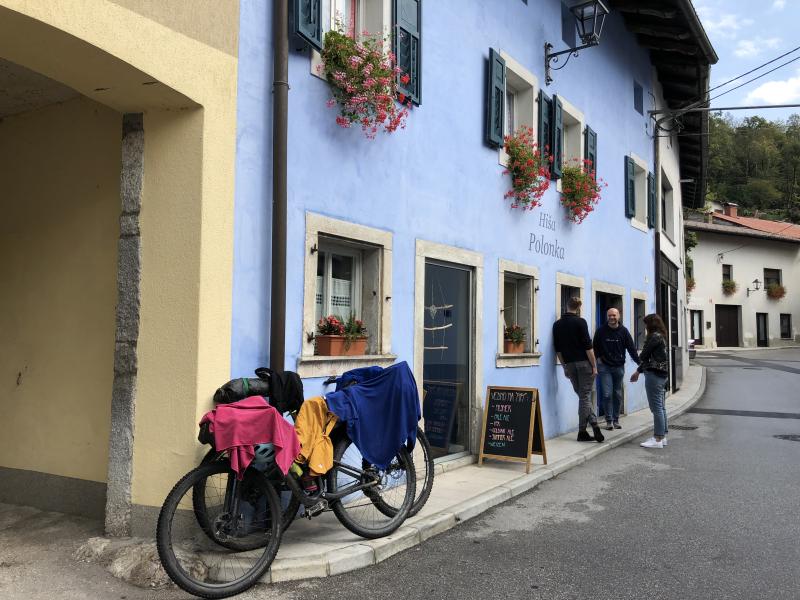 A bicycle is draped with drying clothes