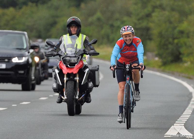 Marcia and her motorbike companion, keeping traffic at a safe distance