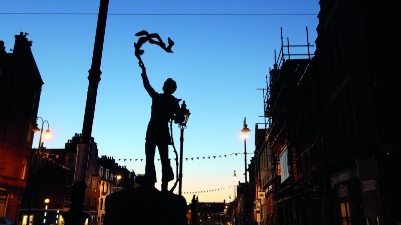 A statue of a man in a town square