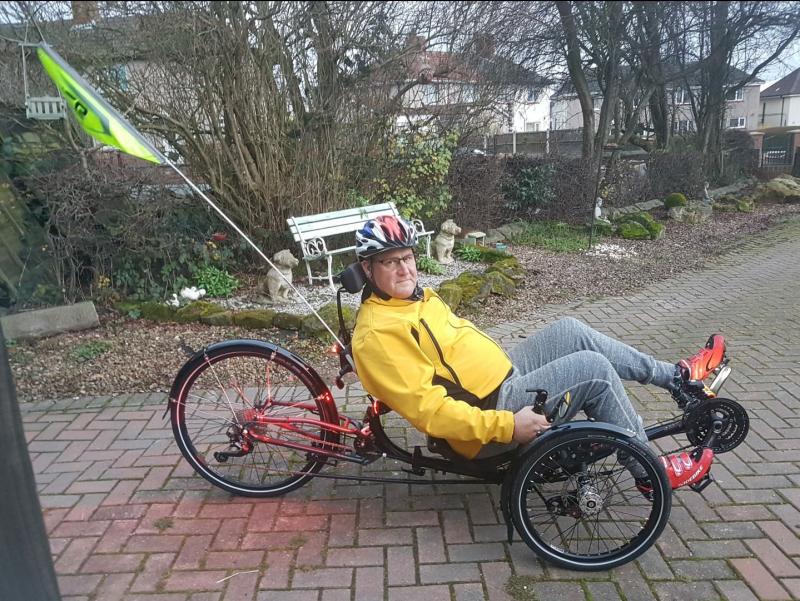 man on recumbent trike