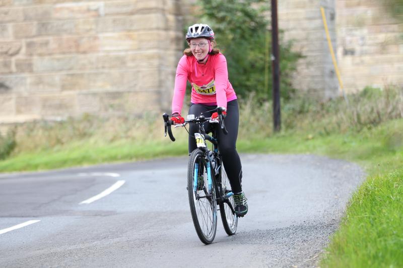 women on road bike