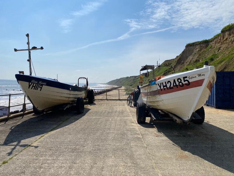 Boats on beach slipway