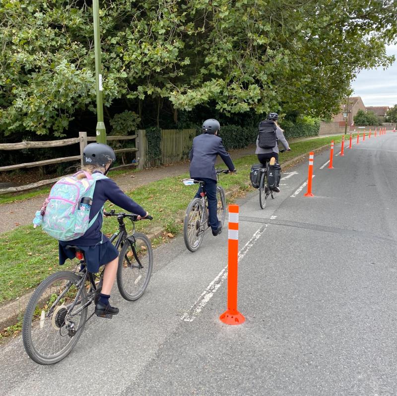Students cycle along the cycle lane