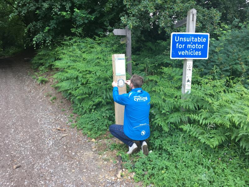 Cycling UK erecting the signage on the Surrey Hills network