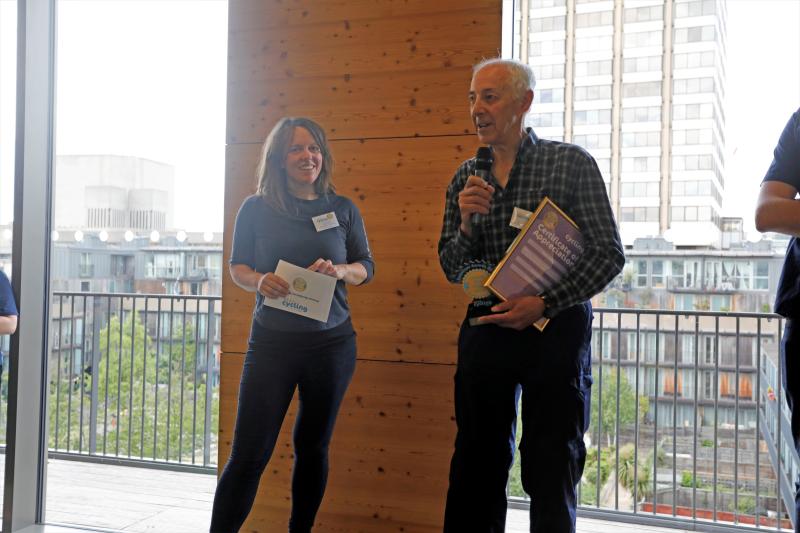 Ted Liddle receiving his award from Jenny Graham