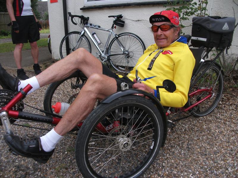 John Davis on his recumbent with his Tri-Vets date bars