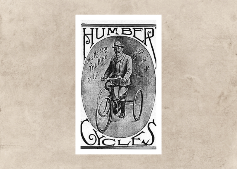 A black and white advert showing King George V on his Humber tricycle