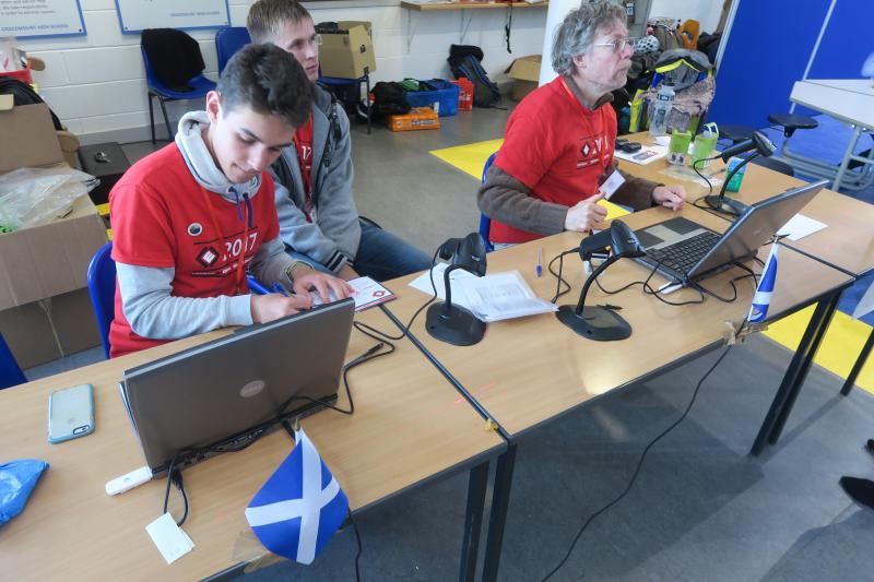 Volunteers working at their desks at a checkpoint in Edinburgh. Photo by Olaf Storbeck