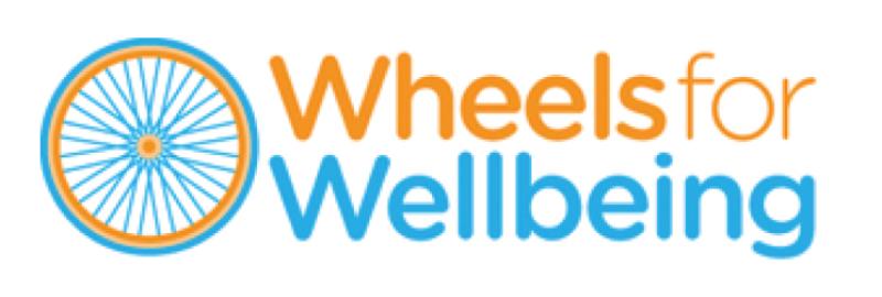 Wheels for Wellbeing logo. An orange and blue bicycle wheel sits next to the words Wheels for wellbeing, also coloured in orange and blue