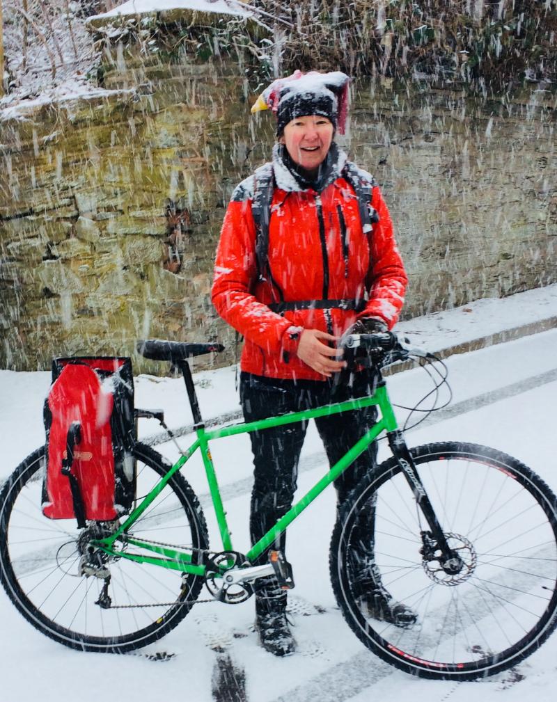 Liz Colebrook cycling in the snow