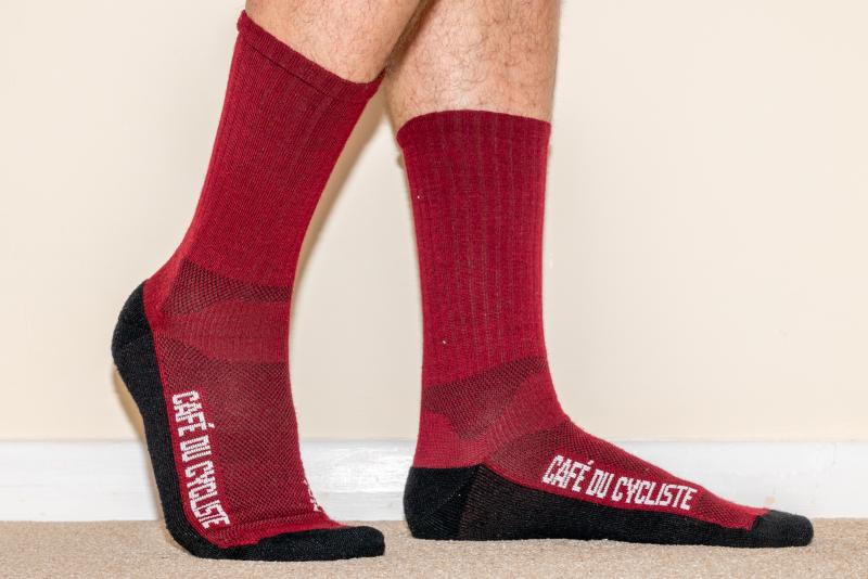 A man wears two red socks