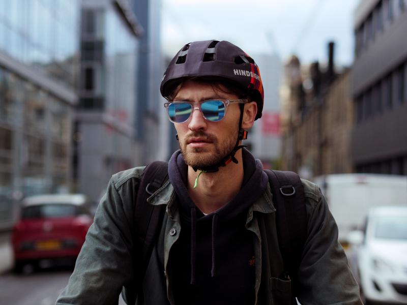 Male cyclist road cycling in Hindsight glasses