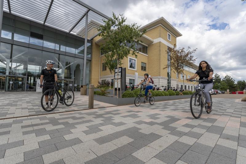 Three people cycling to work