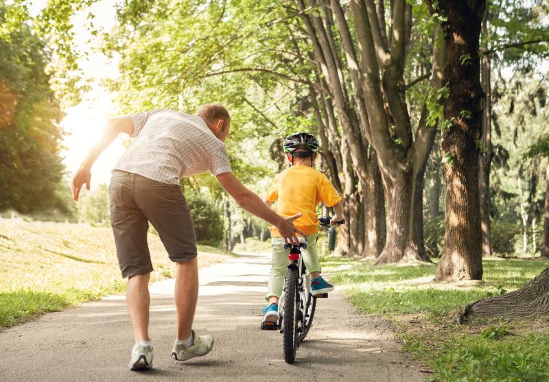 Child learning to ride