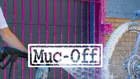 The 'Muc-Off' logo with a person cleaning a bike with product