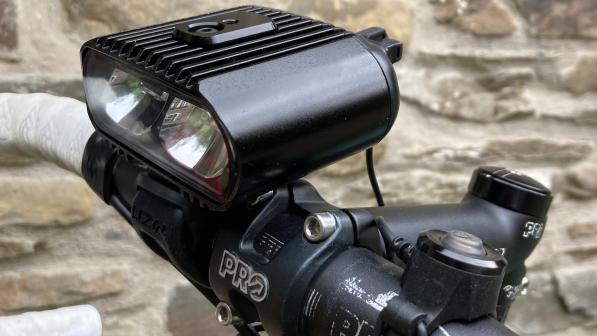A close-up of the Lezyne Power HB Drive STVZO 500 front cycle light mounted to a handlebar