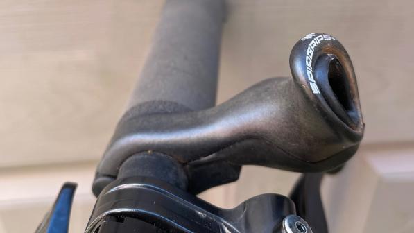 The Spirgrips+ attached to a flat handlebar just outside where the stem fits to the bar