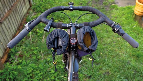 The Jones SG Loop H-Bar standard rise alternative handlebar in place on a touring bike