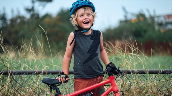 Boy next to his bike