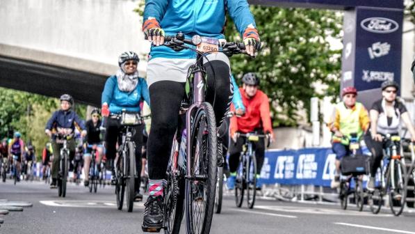 Misbah Choughtai, nominated as a community champion in Cycling UK’s 100 Women in Cycling 2024, on her bike for a cycling event