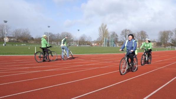 Andrea laughing on Bike.jpg