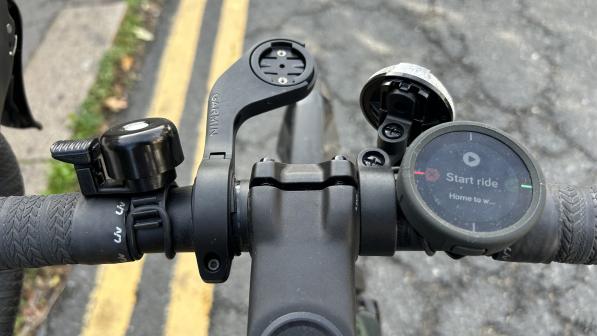 The Beeline Velo 2 attached to the handlebar of a bike, with the screen showing 'Start ride'