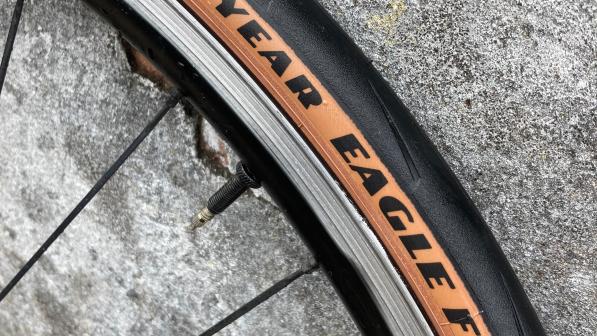 A section of a bike wheel showing the Goodyear Eagle F1 tyre