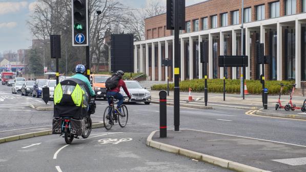 Cycling infrastructure being used in Birmingham by two cyclists