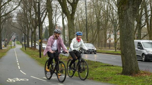 Two people cycle on sale