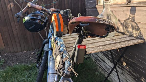 The Cycplus L7 Radar Tail Light fitted to the seatpost of a loaded touring bike