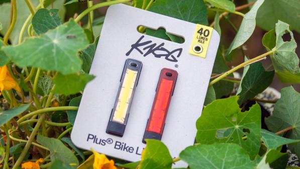 A set of Knog Plus bike lights sat in nasturiums